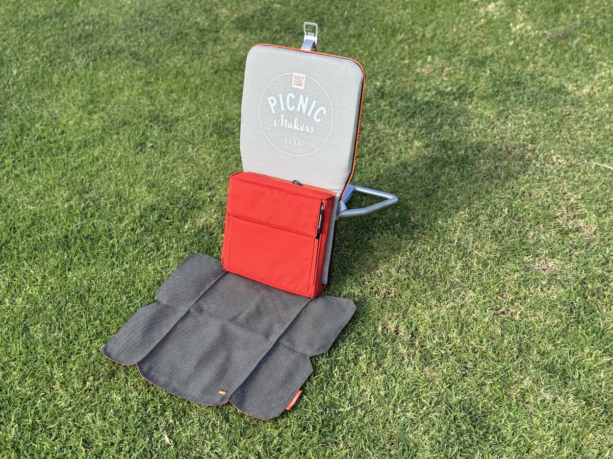 suba.backrest.silvergrey-with-attached-suba.store.pocket-via-suba.zipsystem-on-grass-sunlit-outdoor-setting